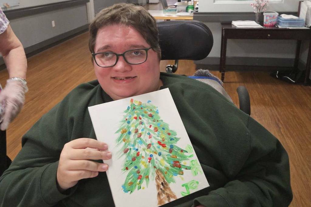 Jessie Simpson of Kamloops celebrating the holidays in his care home. (Sue Simpson/Facebook)